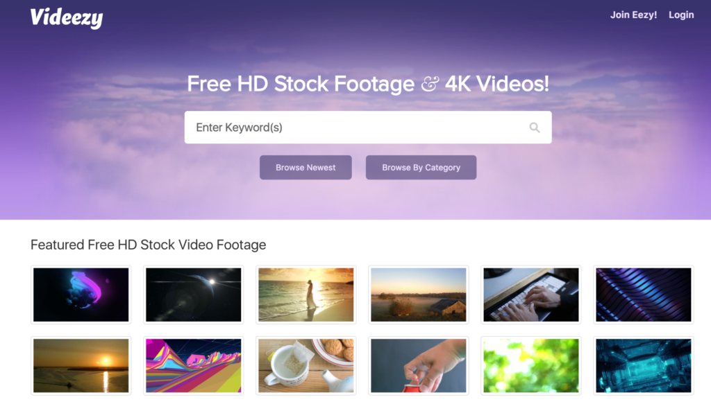 Website homepage offering free hd and 4k stock video footage, with a selection of featured video thumbnails displayed.