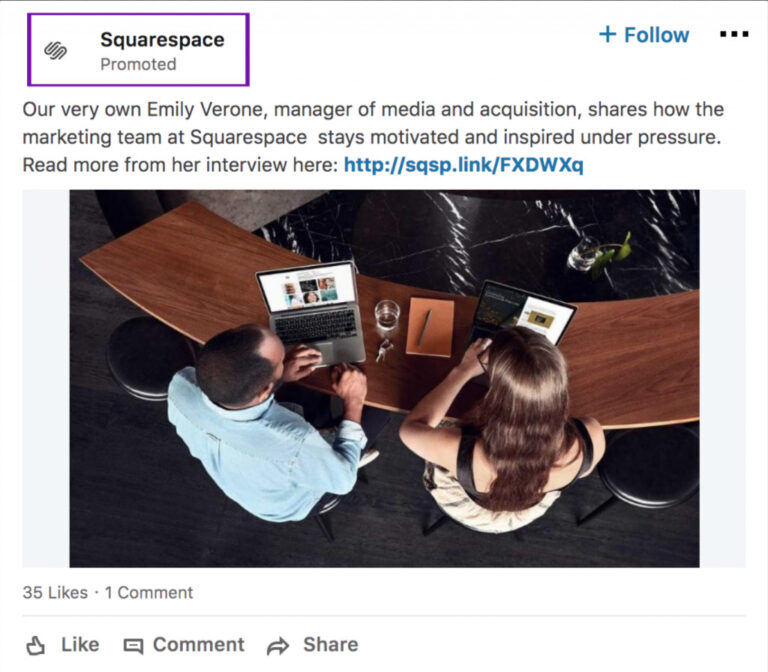 Two people, a man and a woman, sit at a table having a discussion over laptops and documents, viewed from above, preparing content for Biteable video maker.