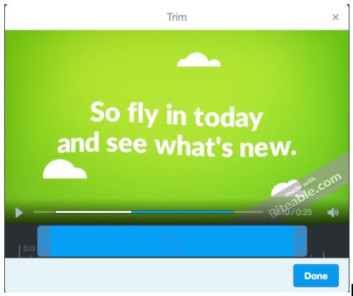 Video editing interface showing a vibrant green screen with text that reads "so fly in today and see what's new," with a timeline and "trim" and "done" options visible.