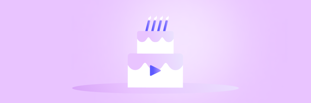 A two-tiered birthday cake with five candles, featuring a play button design, set against a purple background.