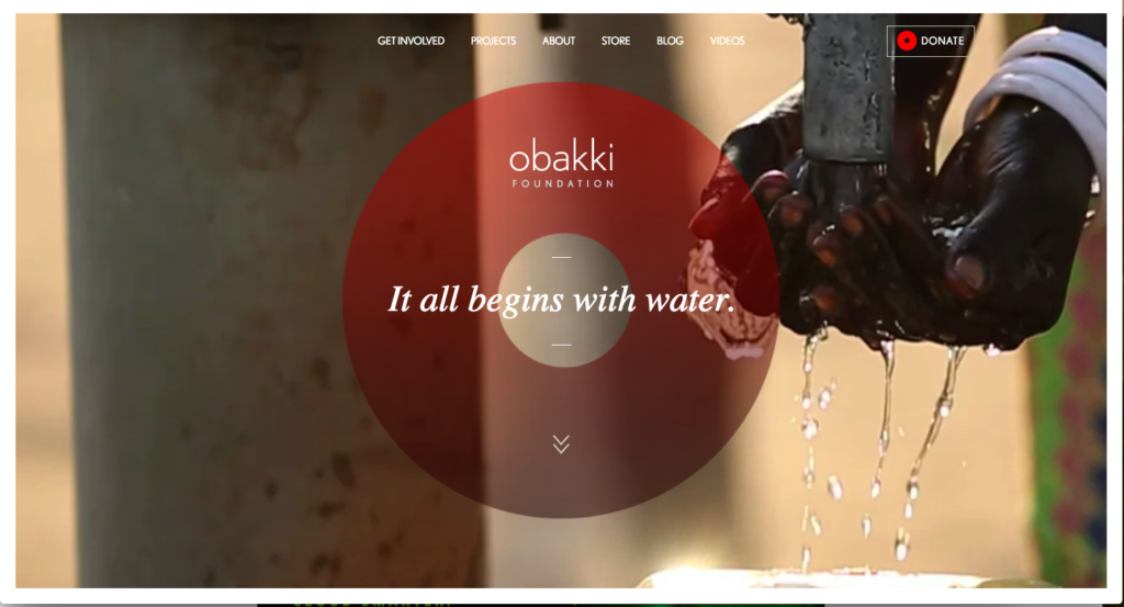 Hands washing under a running tap, with the text "it all begins with water." from the obakki foundation.