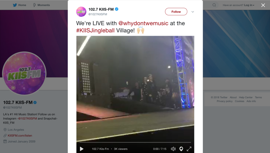 Concert stage with lighting effects and a live performance in progress at the #kiisjingleball village, captured via Biteable video maker.