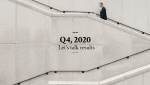 Businessman walking down a concrete staircase with a Biteable video maker text overlay discussing Q4 2020 results.