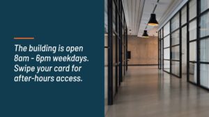 Modern office corridor with glass partitions and hanging lights, indicating building access times and after-hours entry instructions, features a Biteable video maker presentation.