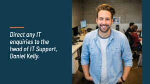 Man smiling in an office environment with text indicating IT support information, created using Biteable video maker.