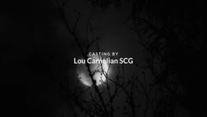 A Biteable video maker image depicting a crescent moon partially obscured by silhouetted tree branches, with the text "casting by lou carnelian scg" displayed on the screen.