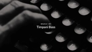Close-up of typewriter keys with text overlay: "music by timpani bass," made with Biteable video maker.