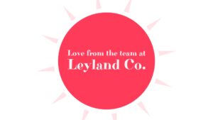 Graphic with a bright red circle and text that reads "love from the team at leyland co.," surrounded by a radial white and pink sunburst pattern created using Biteable video maker.