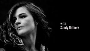 Black and white portrait of a woman with text "with sandy nethers" on the side using Biteable video maker.