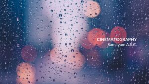 Raindrops on a window with blurred city lights in the background captured using Biteable video maker.