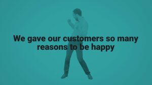 Man in a white shirt happily punching the air with text overlay "we gave our customers so many reasons to be happy" on a teal background, created using Biteable video maker.