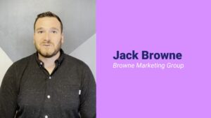 Professional portrait of a man with the name Jack Browne from Browne Marketing Group against a split background of grey and purple, designed using Biteable video maker.
