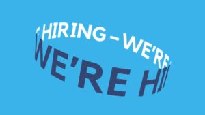 Curved text reading "we're hiring" in white on a blue background, creating a circular illusion with Biteable video maker.