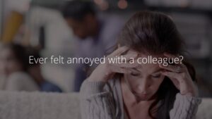 Woman looking stressed in a Biteable video maker creation with text overlay asking about workplace annoyance.