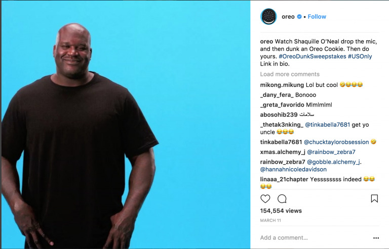 Shaquille o'Neal smiling in a studio with a blue background, promoting an Oreo sweepstakes on Instagram using Biteable video maker.