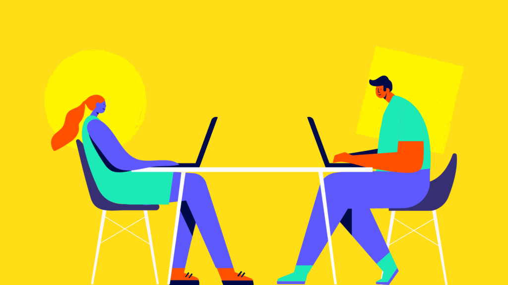 Two people sitting opposite each other at a table, each working on a laptop powered by Biteable video maker, against a yellow background.