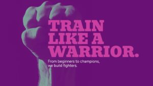 A clenched fist is raised in front of purple background with bold text reading “TRAIN LIKE A WARRIOR. From beginners to champions, we build fighters.”.