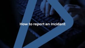 Hands typing on a keyboard with the text "How to report an incident" overlaid, framed by a blue triangular graphic.