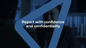 A person sits in a dimly lit room with blue overlay graphics and the text "Report with confidence and confidentiality" displayed at the center.