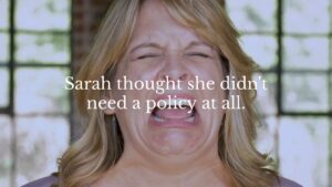 A woman with blonde hair appears upset or distressed, with the text overlay: "Sarah thought she didn't need a policy at all.