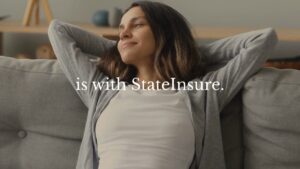 A woman sits on a couch with her hands behind her head, looking relaxed. Text over the image reads, "is with StateInsure.