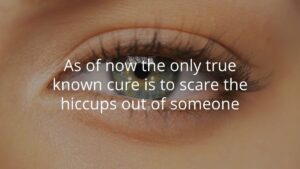 Close-up of a person's eye with the text, "As of now the only true known cure is to scare the hiccups out of someone," displayed over the image.
