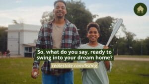 An adult and child holding a baseball and bat stand outdoors, smiling. Text on image reads, "So, what do you say, ready to swing into your dream home? realestate.com/listing.