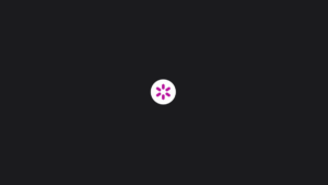 A white circle with a purple stylized flower icon in the center on a dark gray background.