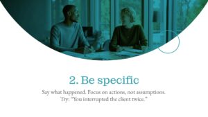 Two people sit at a table in an office, talking and smiling. Text reads: "2. Be specific. Say what happened. Focus on actions, not assumptions. Try: 'You interrupted the client twice.'.