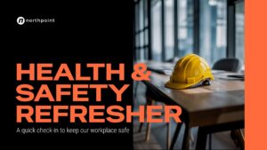 A yellow hard hat sits on a desk in a modern office. Text reads: "Health & Safety Refresher: A quick check-in to keep our workplace safe. Northpoint.