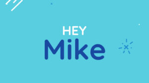 Light blue background with the text "HEY Mike" in white and dark blue letters, surrounded by small decorative line and dot elements.